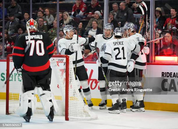 Carl Grundstrom of the Los Angeles Kings celebrates his second period goal against Joonas Korpisalo of the Ottawa Senators with teammates Jordan...