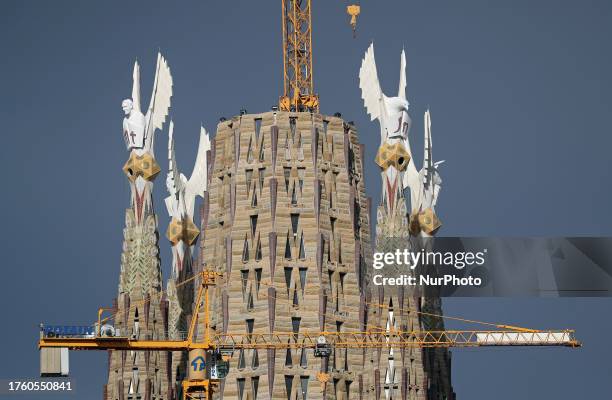 The Sagrada Familia with the four towers of the Evangelists already completed, crowned by the winged figures of the tetramorphs, work of the sculptor...