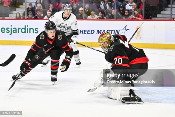 Jakob Chychrun of the Ottawa Senators watches as the puck is shot towards goaltender Joonas Korpisalo during the third period against the Los Angeles...