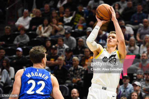Lauri Markkanen of the Utah Jazz shoots over Franz Wagner of the Orlando Magic during a game at Delta Center on November 02, 2023 in Salt Lake City,...
