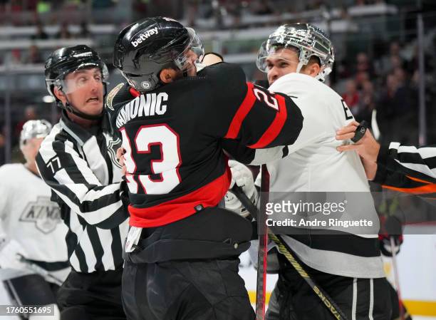 Travis Hamonic of the Ottawa Senators pushes and shoves with Andreas Englund of the Los Angeles Kings after the whistle at Canadian Tire Centre on...