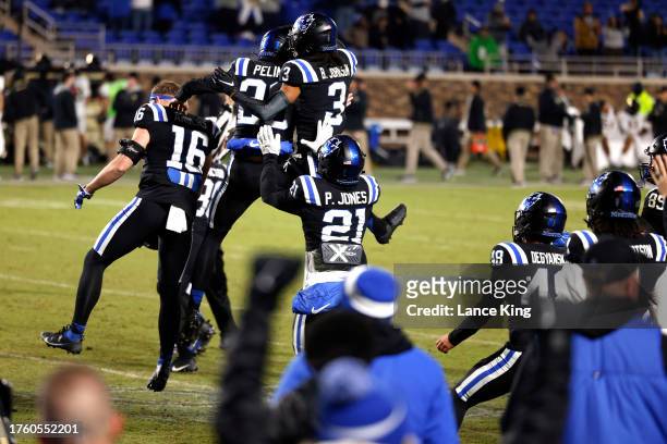Todd Pelino of the Duke Blue Devils celebrates with teammates following his game-winning field goal against the Wake Forest Demon Deacons at Wallace...