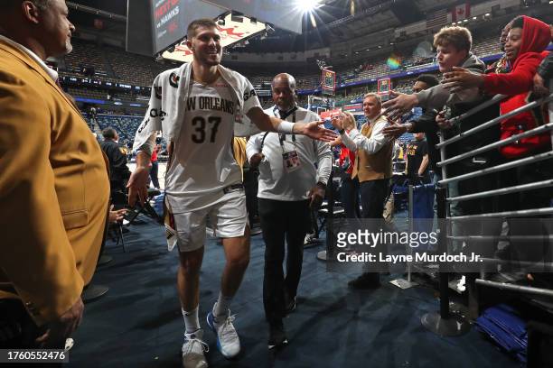 Matt Ryan of the New Orleans Pelicans high fives fans after the game against the Detroit Pistons on November 2, 2023 at the Smoothie King Center in...