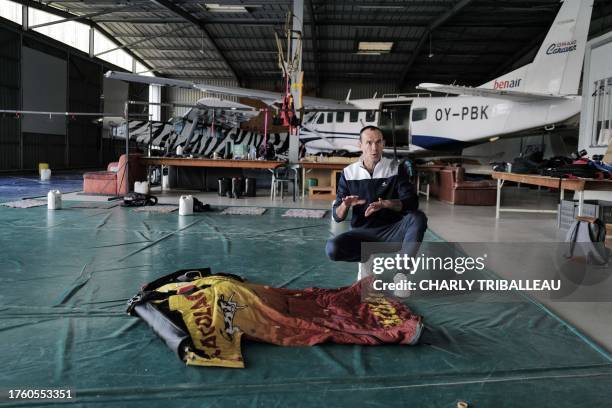 French wingsuit acrobat Boris Paturet prepares his wingsuit before a training flight in Pamiers, southwestern France, on October 30, 2023. Boris...