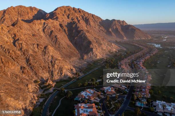 In an aerial view, the PGA West golf resort abuts the native habitat of endangered desert bighorn sheep and lacks completed fencing to keep bighorns...