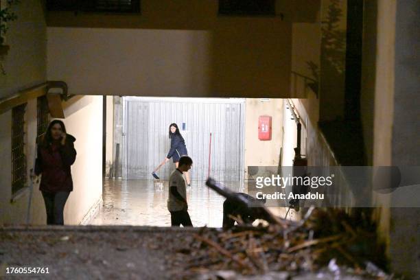 People cleanup an underground station after heavy rainfall causes flooding in Florence, Italy on November 02, 2023. Prato and Tuscany are among the...