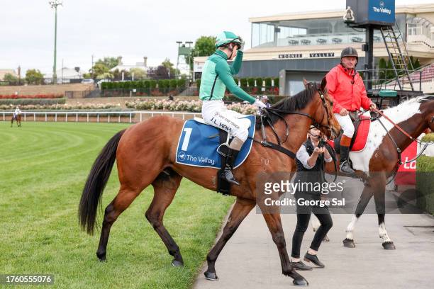Jamie Kah returns to the mounting yard aboard Mr Mojo Risin' after winning the Christmas At The Valley Handicap at Moonee Valley Racecourse on...