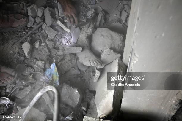 Person is stuck under rubble as search and rescue operations continue after an Israeli attack on Maghazi Refugee Camp in Deir al Balah, Gaza on...