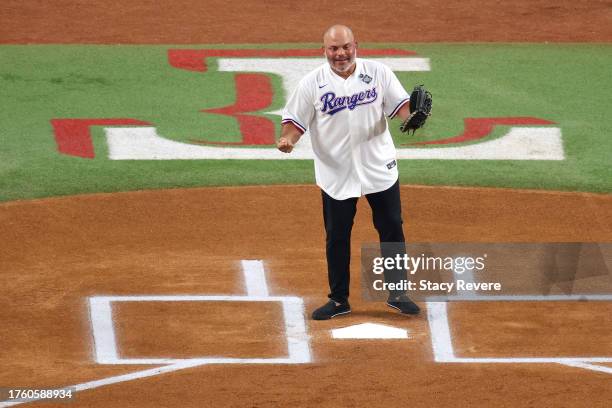 Former member of the Texas Rangers prepares to receive a ceremonial first pitch prior to Game One of the World Series against the Arizona...