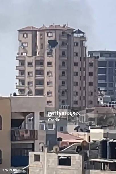 This image grab taken from AFPTV video footage on November 3 shows a gaping hole following a strike on the Hajji building, which houses several...