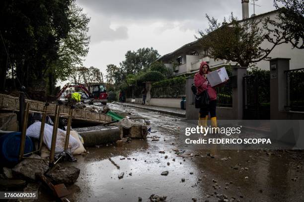 Woman walks past a wall that collapsed in Montemurlo, near Prato, after heavy rain last night, on November 3, 2023. Storm Ciaran hit Tuscany late on...