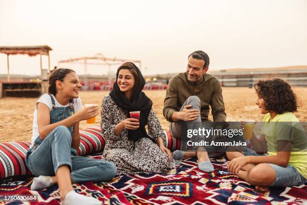 young family drinking tea in dubai - dubai food stock pictures, royalty-free photos & images