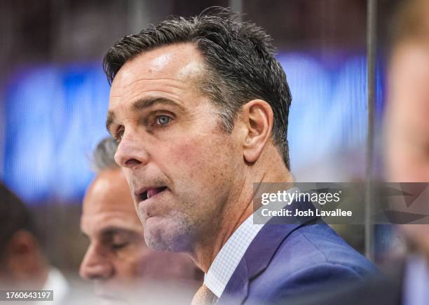 San Jose Sharks head coach David Quinn is seen on the bench during the second period against the Carolina Hurricanes at PNC Arena on October 27, 2023...