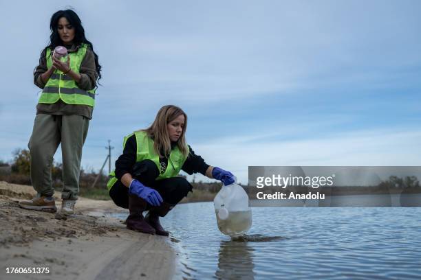 Ukrainian scientists and eco-activists collect water and bottom sediments from the Ingulets River in the villages of Snigurivka, Mykolaiv Oblast,...