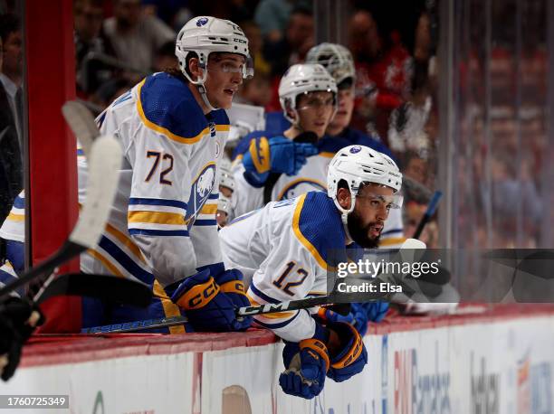 Tage Thompson and Jordan Greenway of the Buffalo Sabres watch the final minute of the game against the New Jersey Devils at Prudential Center on...