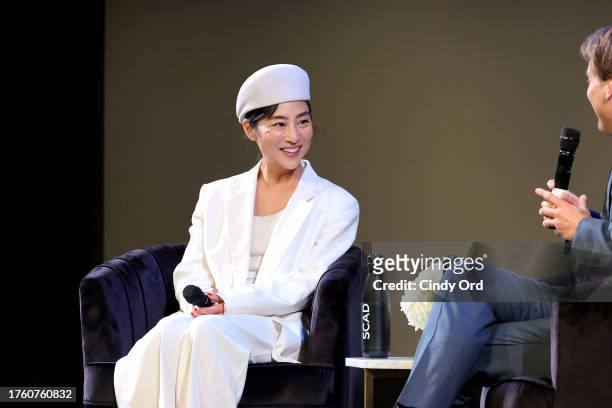 Greta Lee seen onstage at the "Past Lives" Q&A during the 26th SCAD Savannah Film Festival at Lucas Theatre for the Arts on October 27, 2023 in...