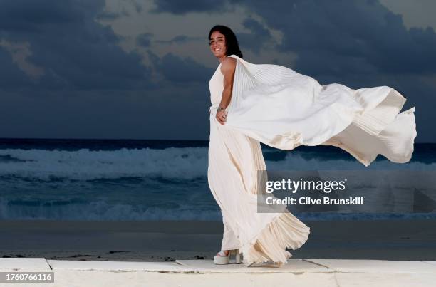 Ons Jabeur of Tunisia poses for a photograph on the beach at the Kempinski Hotel Cancun ahead of the WTA Finals draw ceremony prior to the GNP...