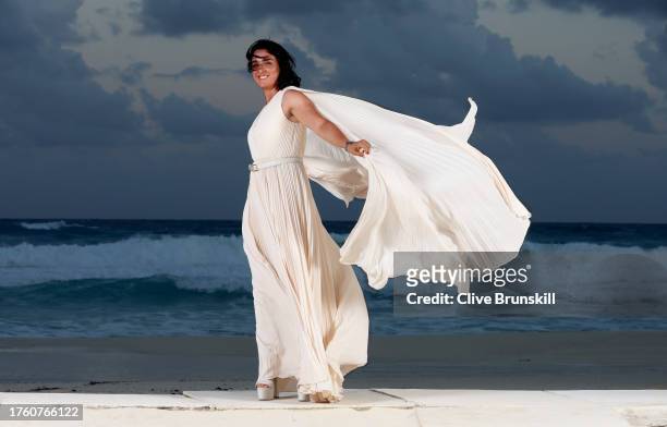 Ons Jabeur of Tunisia poses for a photograph on the beach at the Kempinski Hotel Cancun ahead of the WTA Finals draw ceremony prior to the GNP...