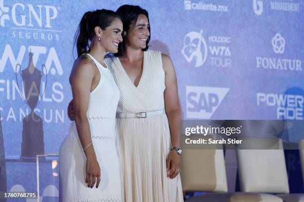 Former tennis player Monica Puig and Ons Jabeur of Tunisia pose for a photo during the draw ceremony at the Kempinski Hotel Cancun for the GNP...