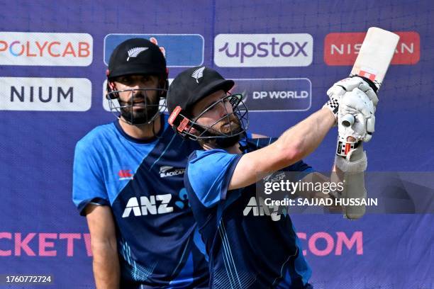 New Zealand's captain Kane Williamson bats in the nets during a practice session on the eve of their 2023 ICC Men's Cricket World Cup one-day...