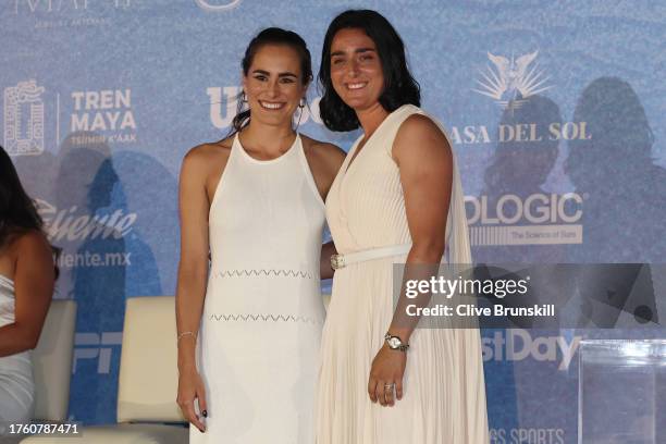 Former tennis player Monica Puig and Ons Jabeur of Tunisia pose for a photo during the draw ceremony at the Kempinski Hotel Cancun for the GNP...