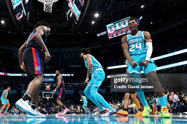 Brandon Miller of the Charlotte Hornets reacts after dunking the ball during the second half of a game against the Detroit Pistons at Spectrum Center...