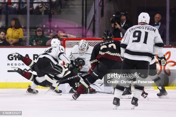 Sean Durzi of the Arizona Coyotes scores a goal past goaltender Cam Talbot of the Los Angeles Kings during the first period of the NHL game at...