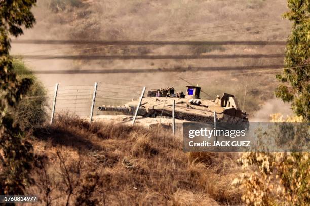 An Israeli army battle tank moves at a position near the border with the Gaza Strip in southern Israel on November 3, 2023 amid the ongoing battles...