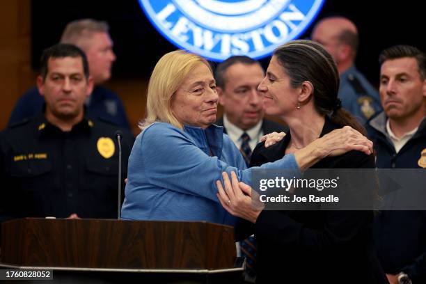 Governor Janet Mills of Maine is embraced before she announces to the media that Robert Card, the suspect in two mass killings, was found dead on...