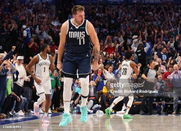 Luka Doncic of the Dallas Mavericks reacts after hitting a three-pointer against the Brooklyn Nets at American Airlines Center on October 27, 2023 in...
