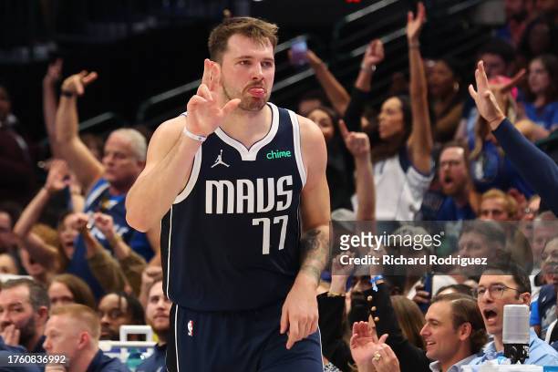 Luka Doncic of the Dallas Mavericks reacts after hitting a three pointer against the Brooklyn Nets at American Airlines Center on October 27, 2023 in...