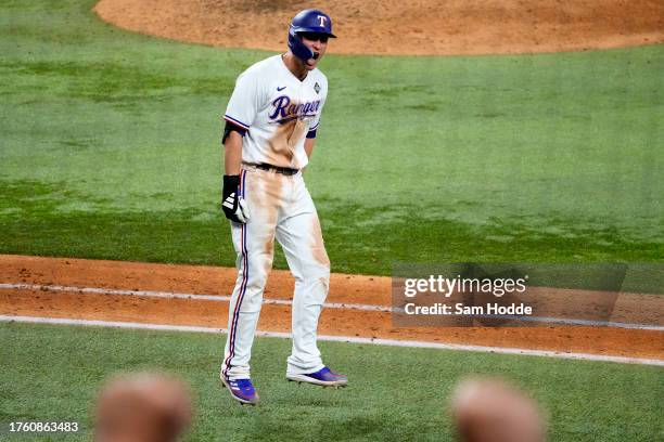 Corey Seager of the Texas Rangers reacts after hitting a home run in the ninth inning against the Arizona Diamondbacks during Game One of the World...