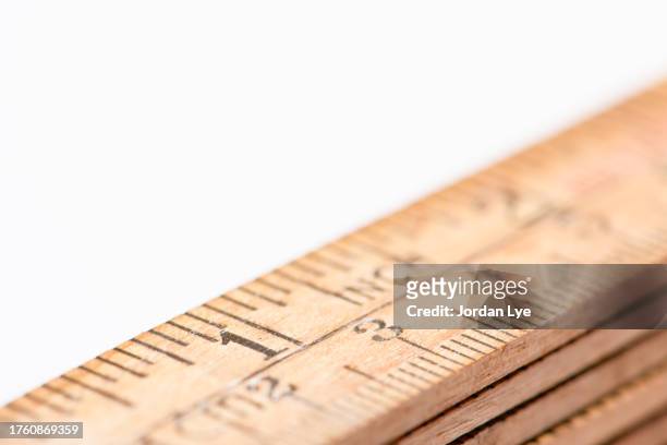 wooden fold ruler on white background - inch stock pictures, royalty-free photos & images