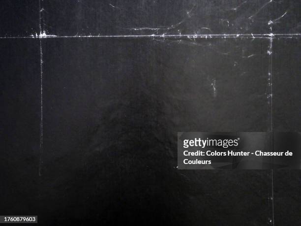 black posters with white edges stuck on a wall in paris, france - newspaper texture stock pictures, royalty-free photos & images