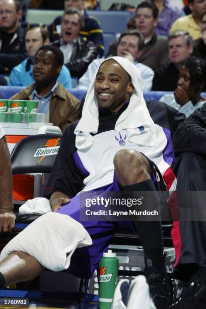 Vince Carter of the Toronto Raptors smiles as he ices his leg on the bench during the game against the New Orleans Hornets at New Orleans Arena on...