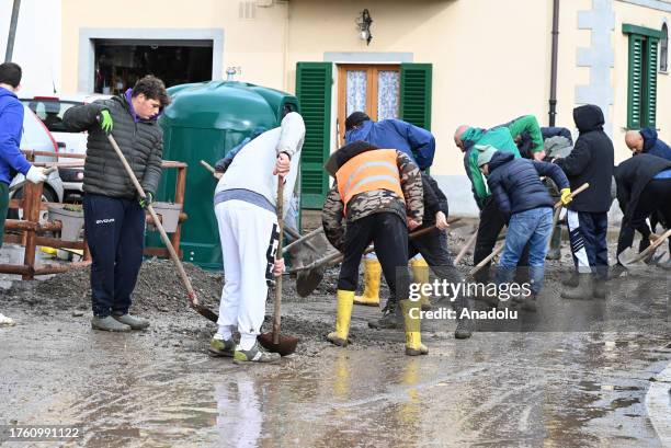 Citizens and officials help clean the destroyed area after heavy flooding at the Tuscany region in Prato, Italy on November 3, 2023. Extreme rainfall...