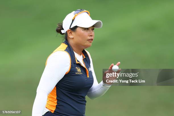 Jasmine Suwannapura of Thailand reacts after a putt on the 18th green during the third round of the Maybank Championship at Kuala Lumpur Golf and...