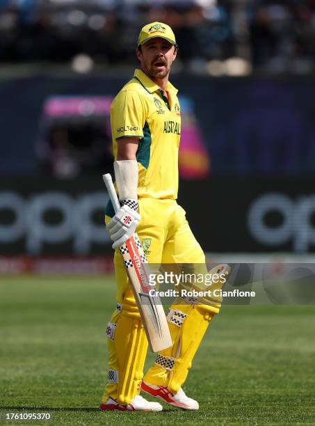 Travis Head of Australia looks dejected after being dismissed after being bowled out by Glenn Phillips of New Zealand during the ICC Men's Cricket...
