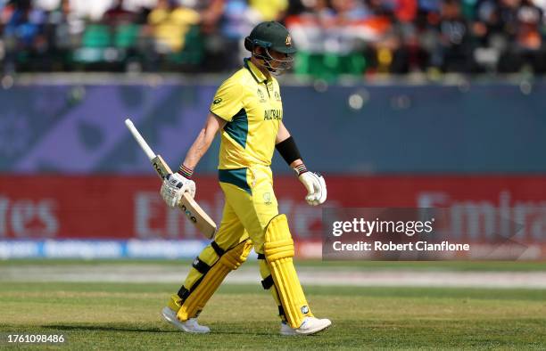 Steve Smith of Australia looks dejected as he leaves the field after being dismissed after being caught out by Trent Boult off the bowling of Glenn...