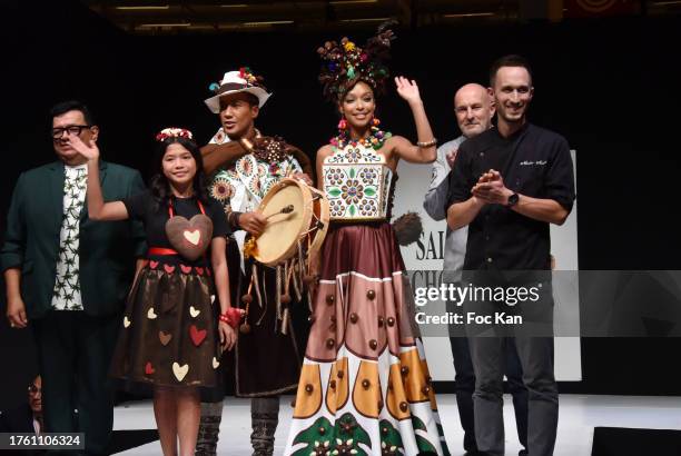 Romelyn, Laurent Maistret and Ophély Mézino dressed By Christophe Bertrand et Nicolas Morin for La Reine Astrid & le créateur Ricardo Dávila for...
