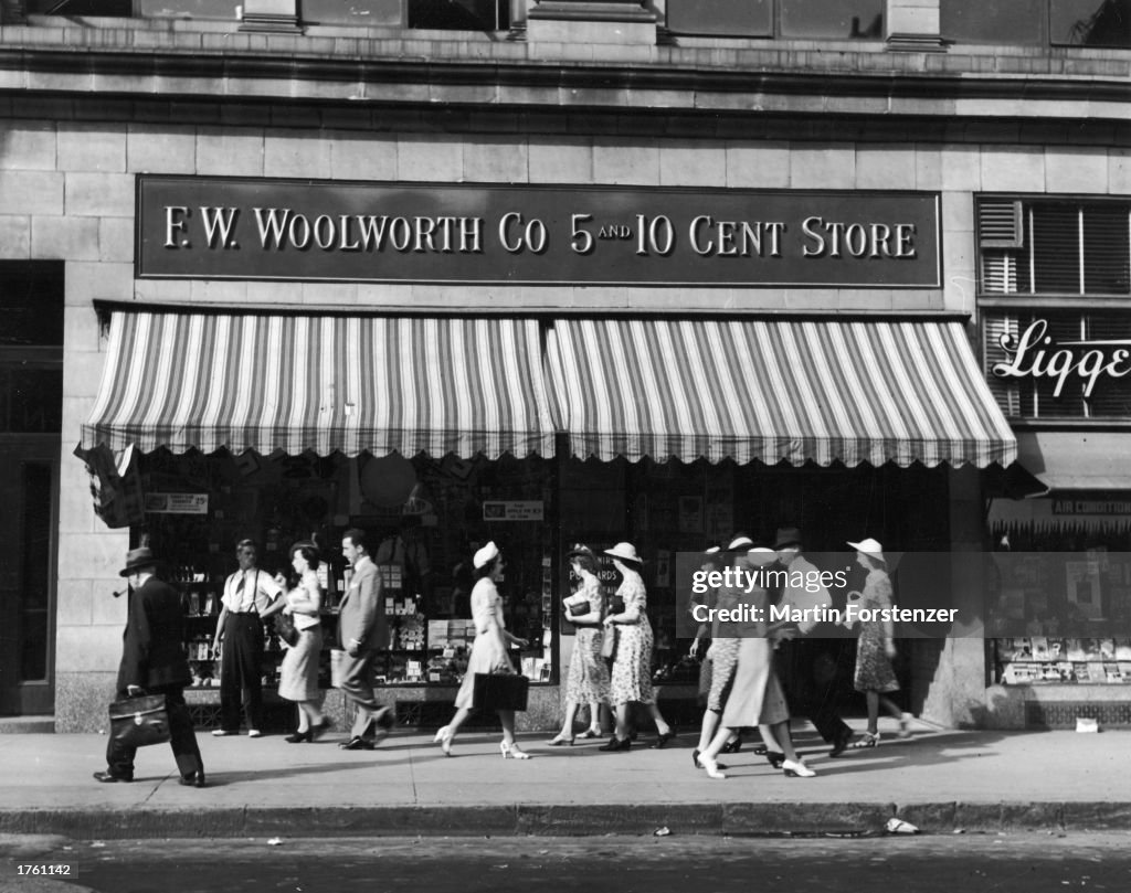 People walk past Woolworth Store