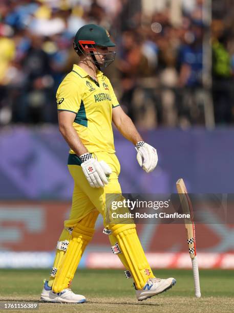 Mitchell Marsh of Australia reacts after being dismissed after being bowled out by Mitch Santner of of New Zealand during the ICC Men's Cricket World...