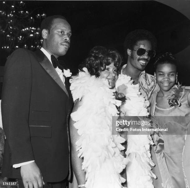 American singer and musician Stevie Wonder poses with his parents and his sister during the 16th Annual Grammy Awards, held at the Hollywood...
