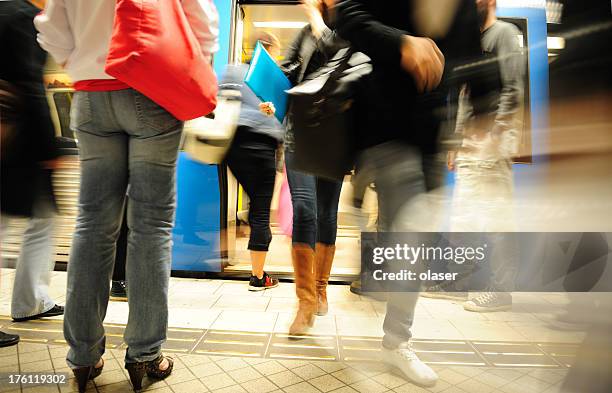 commuters entering and exiting subway train - railroad station platform stock pictures, royalty-free photos & images