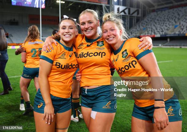 Desiree Miller, Carys Dallinger and Layne Morgan of Australia poses for a photo following victory in the WXV1 match between France and Australia...