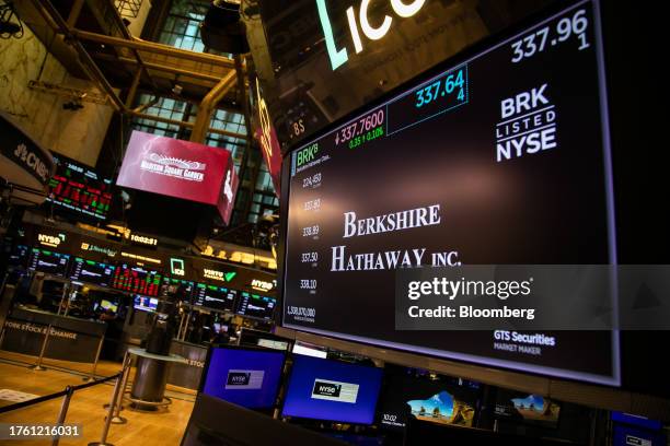 Berkshire Hathaway signage on the floor of the New York Stock Exchange in New York, US, on Tuesday, Oct. 31, 2023. Berkshire Hathaway Inc. Is...