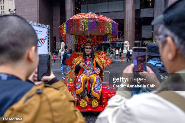 People take photos of a dressed up man during Taiwan Pride 2023 on October 28, 2023 in Taipei, Taiwan. The event, held in Taiwan annually, announces...