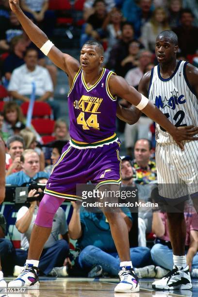 Luther Wright of the Utah Jazz battles for position with Shaquille O'Neal of the Orlando Magic during the 1994 season NBA game at Orlando Arena in...