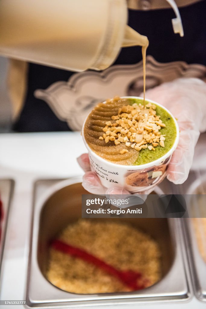 Serving semolina halva with ice cream cup