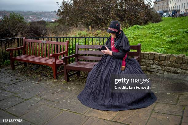 Man dressed in a vintage Salvation Army dress attends Whitby Goth Weekend on October 28, 2023 in Whitby, England. The Whitby Goth Weekend is an...